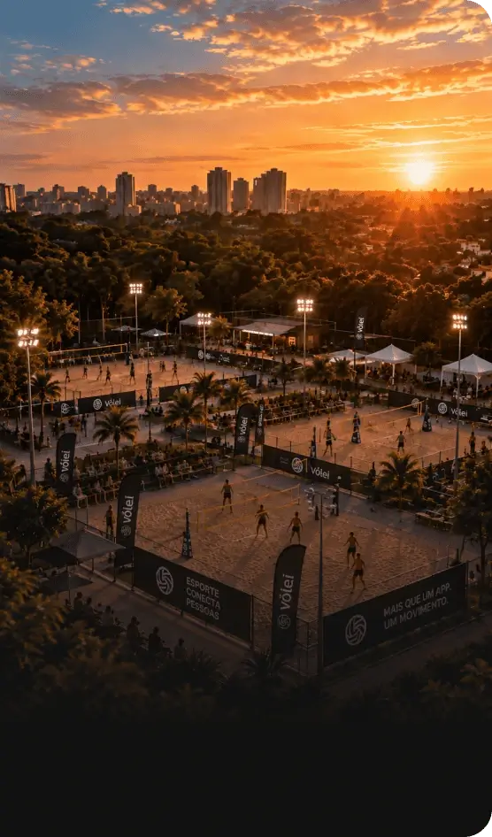 Vista aérea de uma arena de vôlei de praia iluminada ao pôr do sol